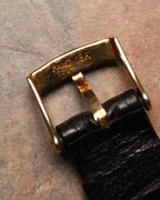 Back view of the Piaget tang buckle stamped “Piaget 18K 750,” mounted on a black leather strap.