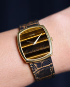 Piaget Ref. 9741 in 18K yellow gold with horizontal Tiger’s Eye dial worn on wrist