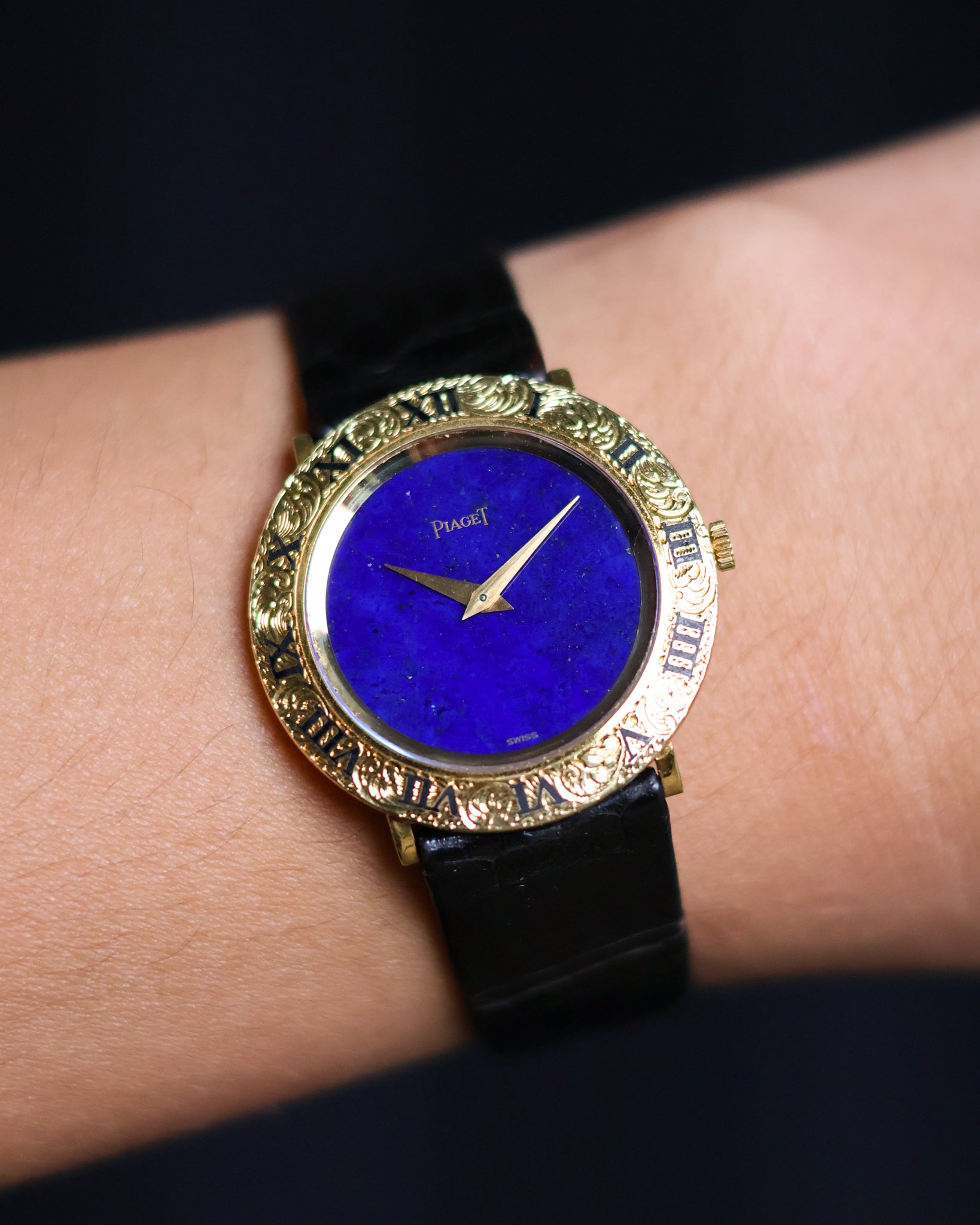 Close-up of a Piaget Ref. 9118 watch with a deep blue lapis lazuli dial on wrist