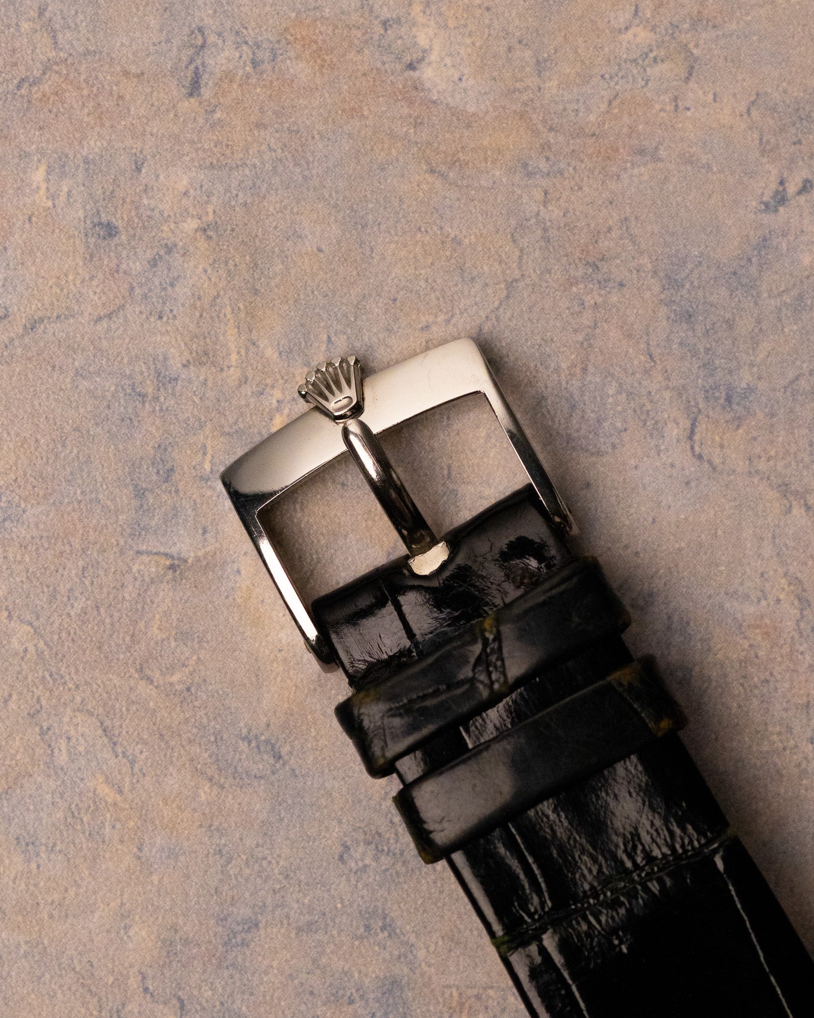 Original Rolex steel buckle fitted to black leather strap on Rolex Cellini 4012