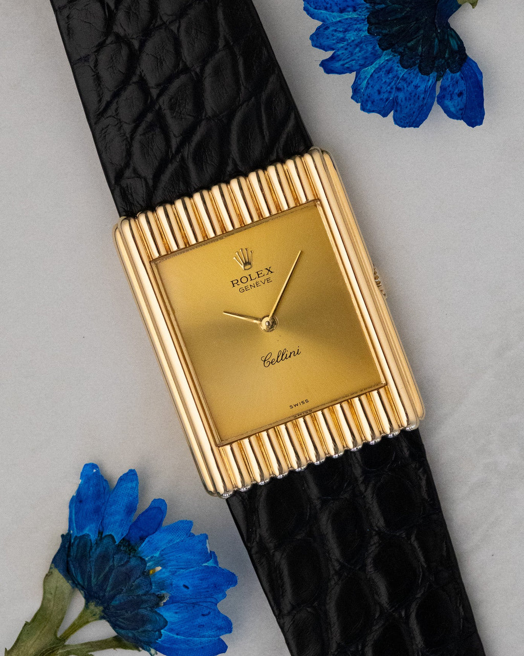 Three-quarter front view of Rolex Cellini Ref. 4016 highlighting vertical ribbed case design and minimalist gold dial