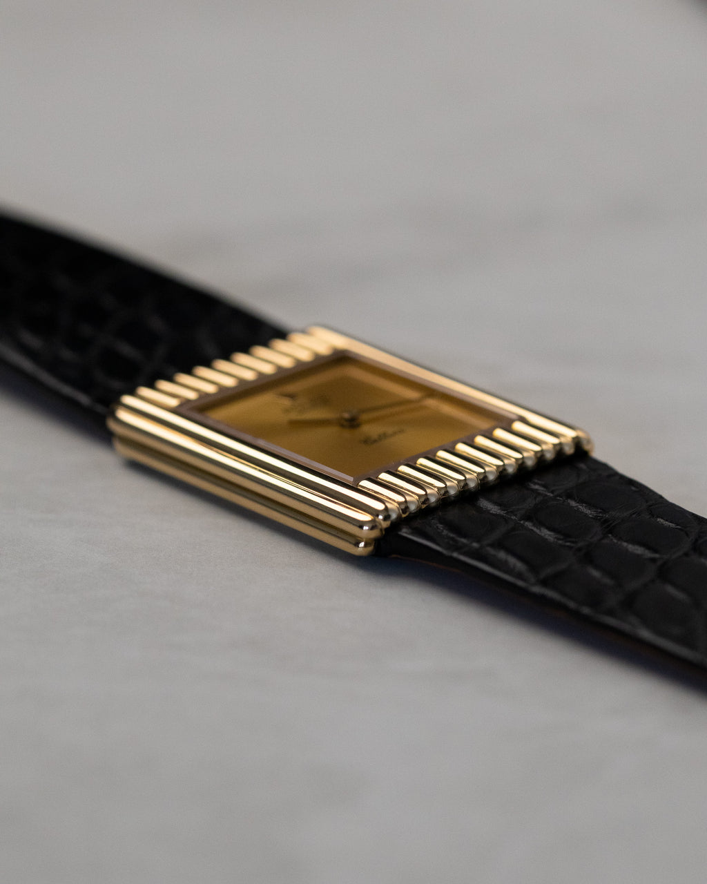 Close-up side angle of Rolex Cellini Ref. 4016 highlighting vertical fluting and polished yellow gold case finish