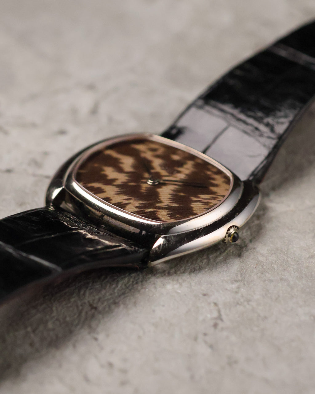 Angled side view of Corum Ref. 27119 emphasizing the smooth case contour and low profile.