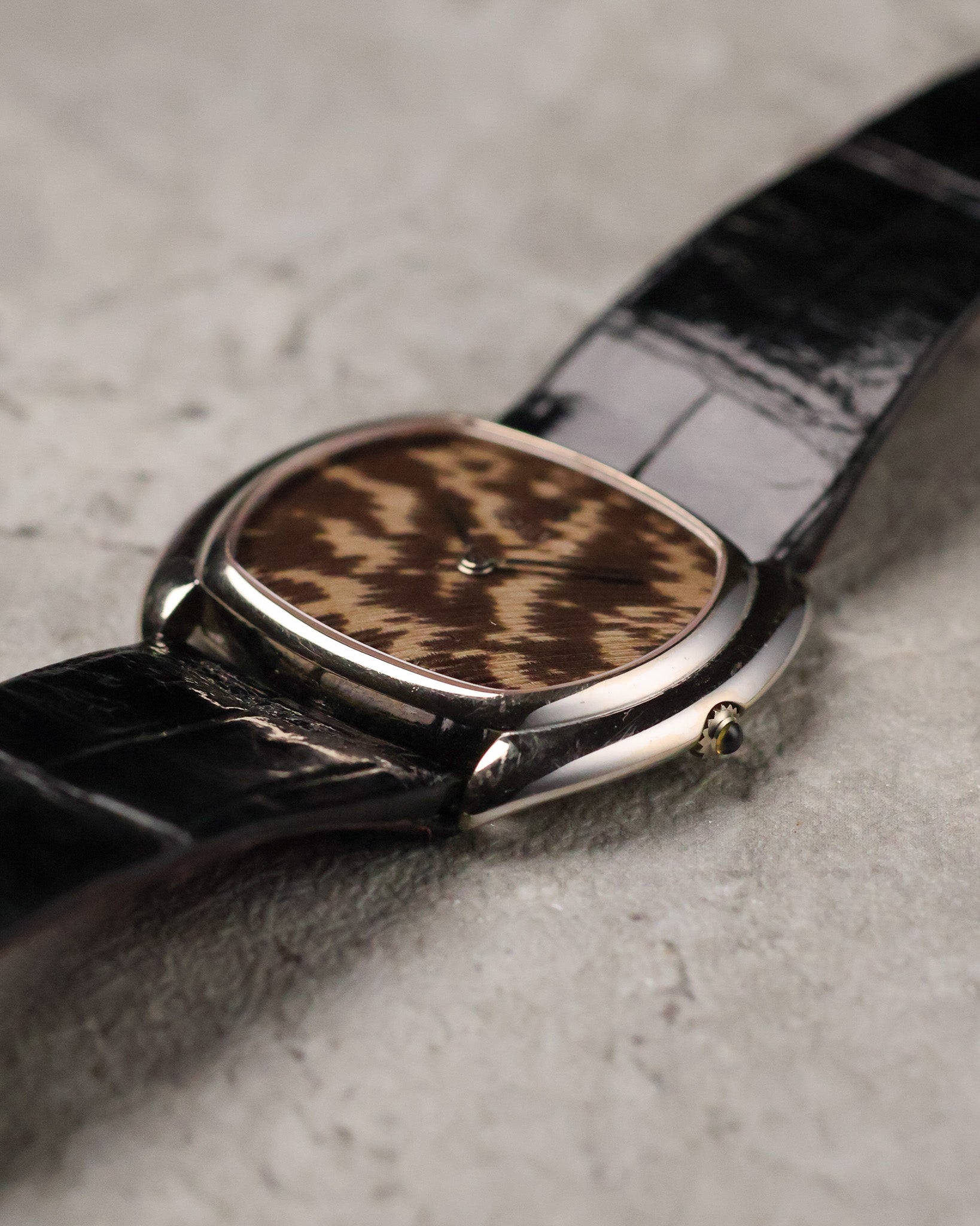 Angled side view of Corum Ref. 27119 emphasizing the smooth case contour and low profile.