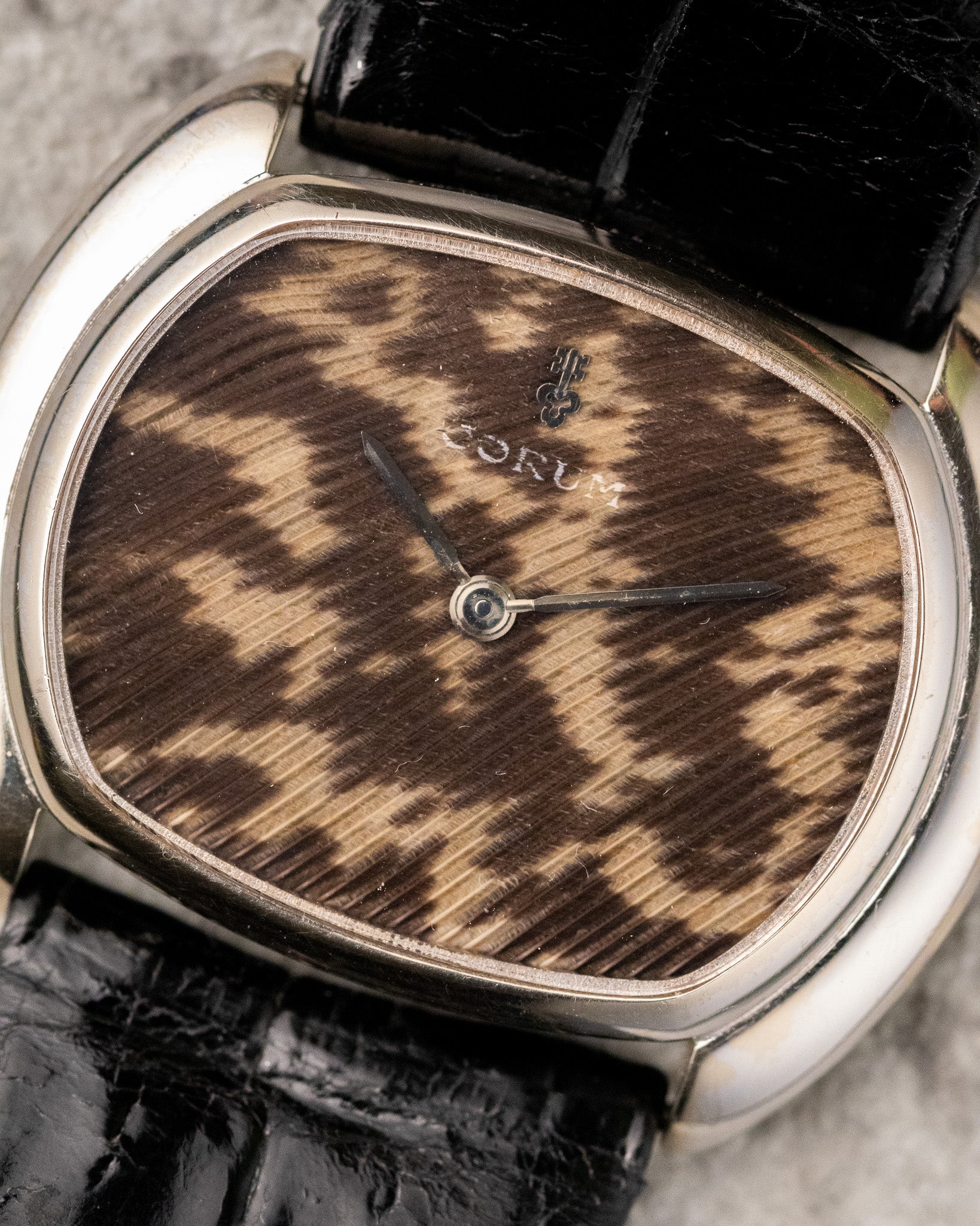 Macro detail of guinea fowl feather dial with organic pattern unique to each Corum Ref. 27119.