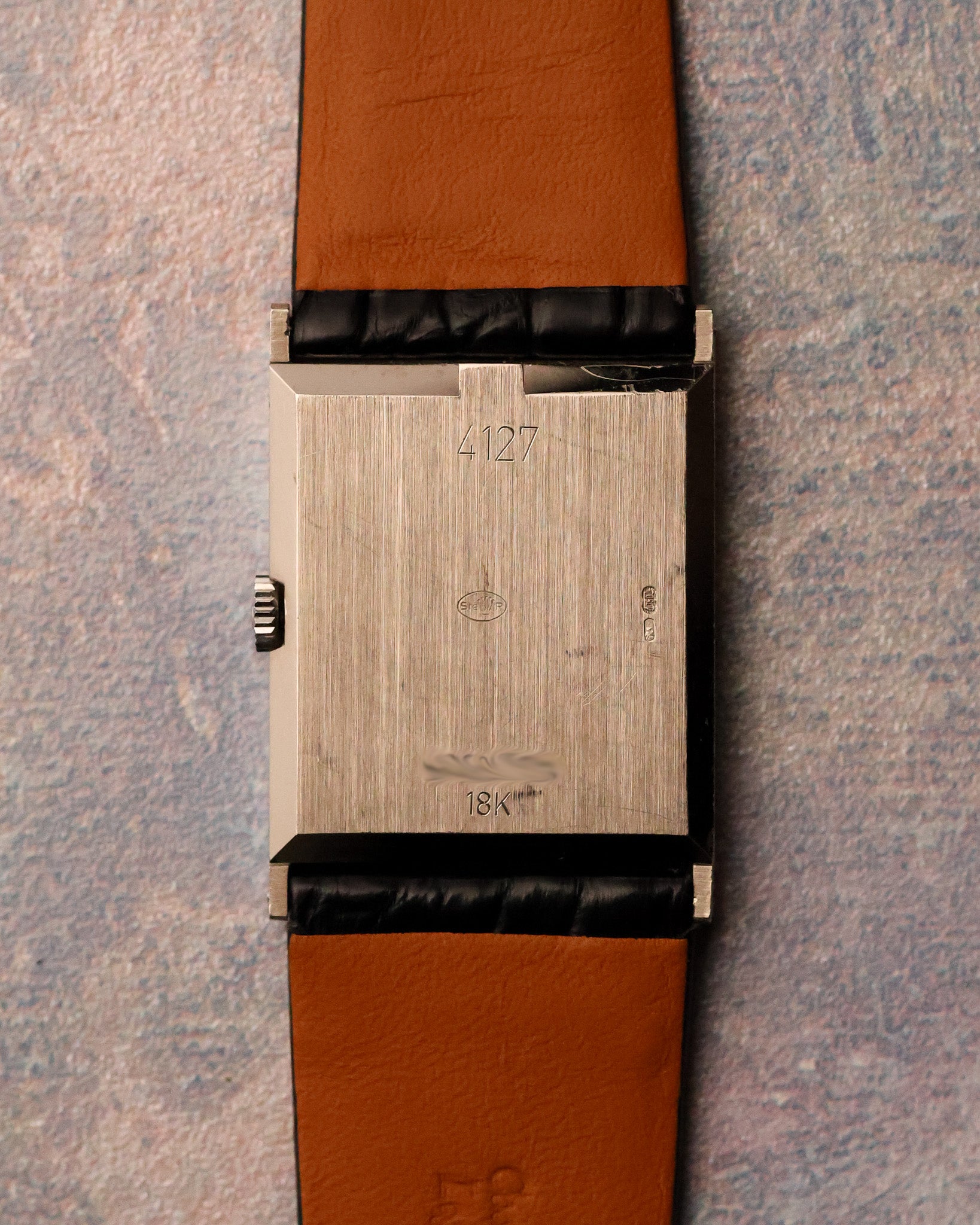 Caseback view of the Rolex Cellini Ref. 4127 in 18K white gold, showing brushed finish, reference engraving, and hallmarks.