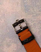 Underside view of the original Rolex 18K white gold buckle showing hallmarks and signature.