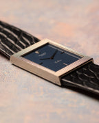 Low-angle side profile highlighting the slim rectangular case and sharp hobnail engraving of the Rolex Cellini Ref. 4127.