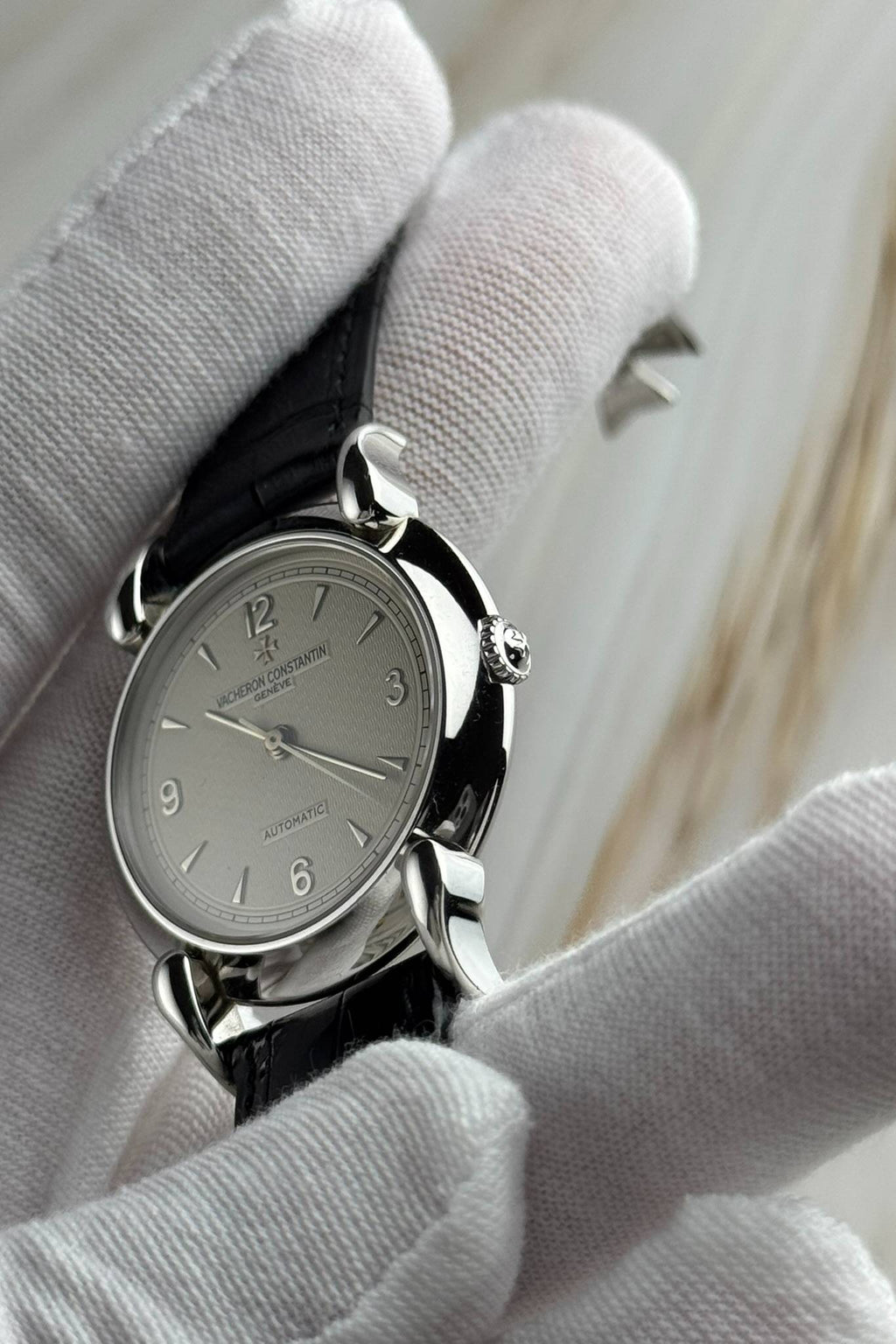 Close-up side angle of Vacheron Constantin Les Historiques watch with elegant curved lugs