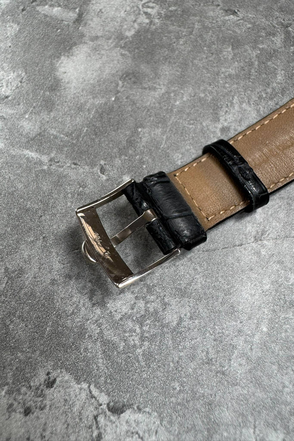 Signed Concord white gold buckle on black alligator leather strap, part of limited edition timepiece