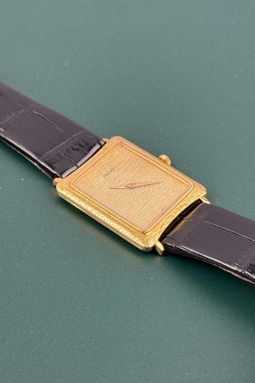 Side profile of Piaget 9254 showing slim 18K gold case and textured bark guilloché detailing