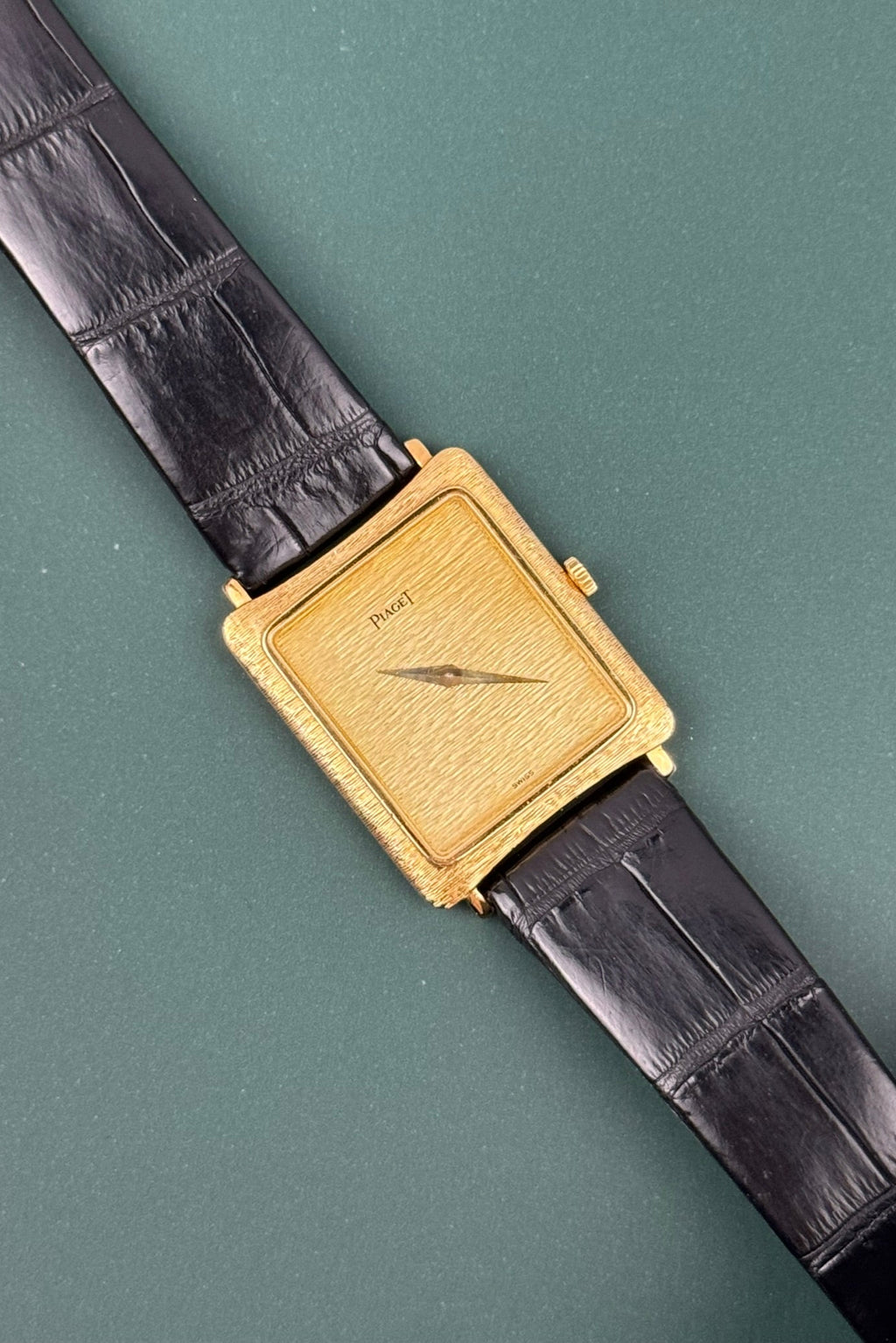 Piaget Ref. 9254 vintage tank watch in 18K gold with bark-style guilloché dial and case, c. 1980s