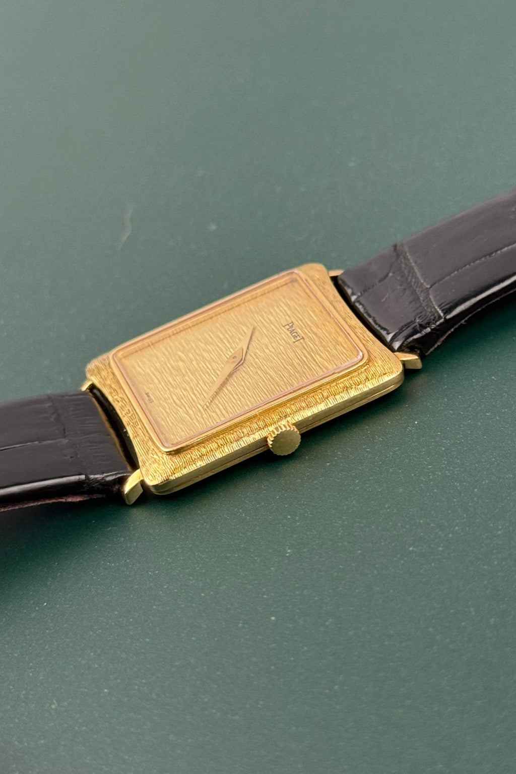 Crown-side angle of Piaget Ref. 9254 highlighting bark guilloché finish and minimalist crown design
