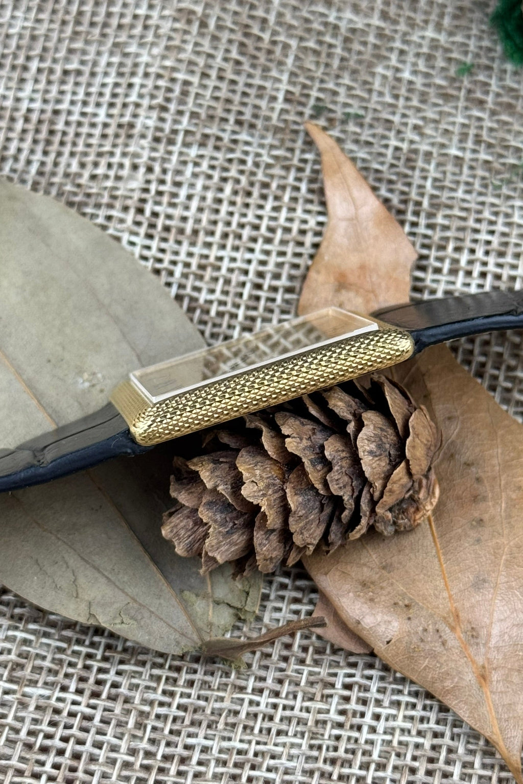 Side profile of Piaget 9152 highlighting ultra-thin gold case and engraved guilloché surface