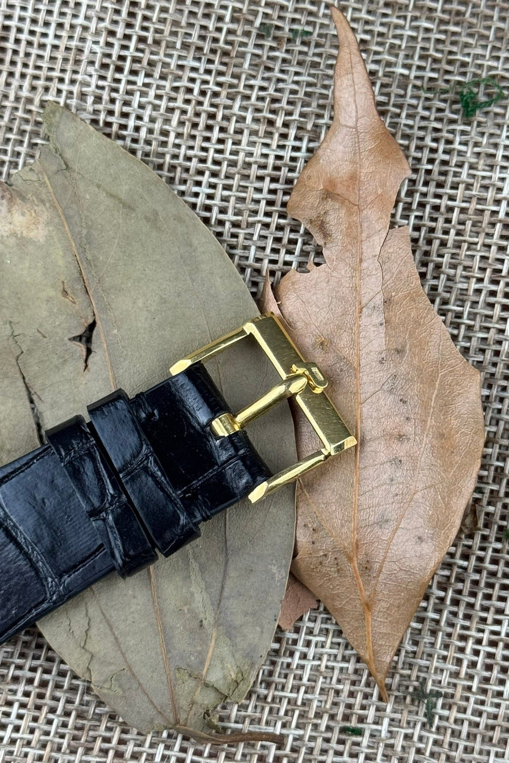 Original Piaget 18K yellow gold buckle engraved with logo, paired with leather strap