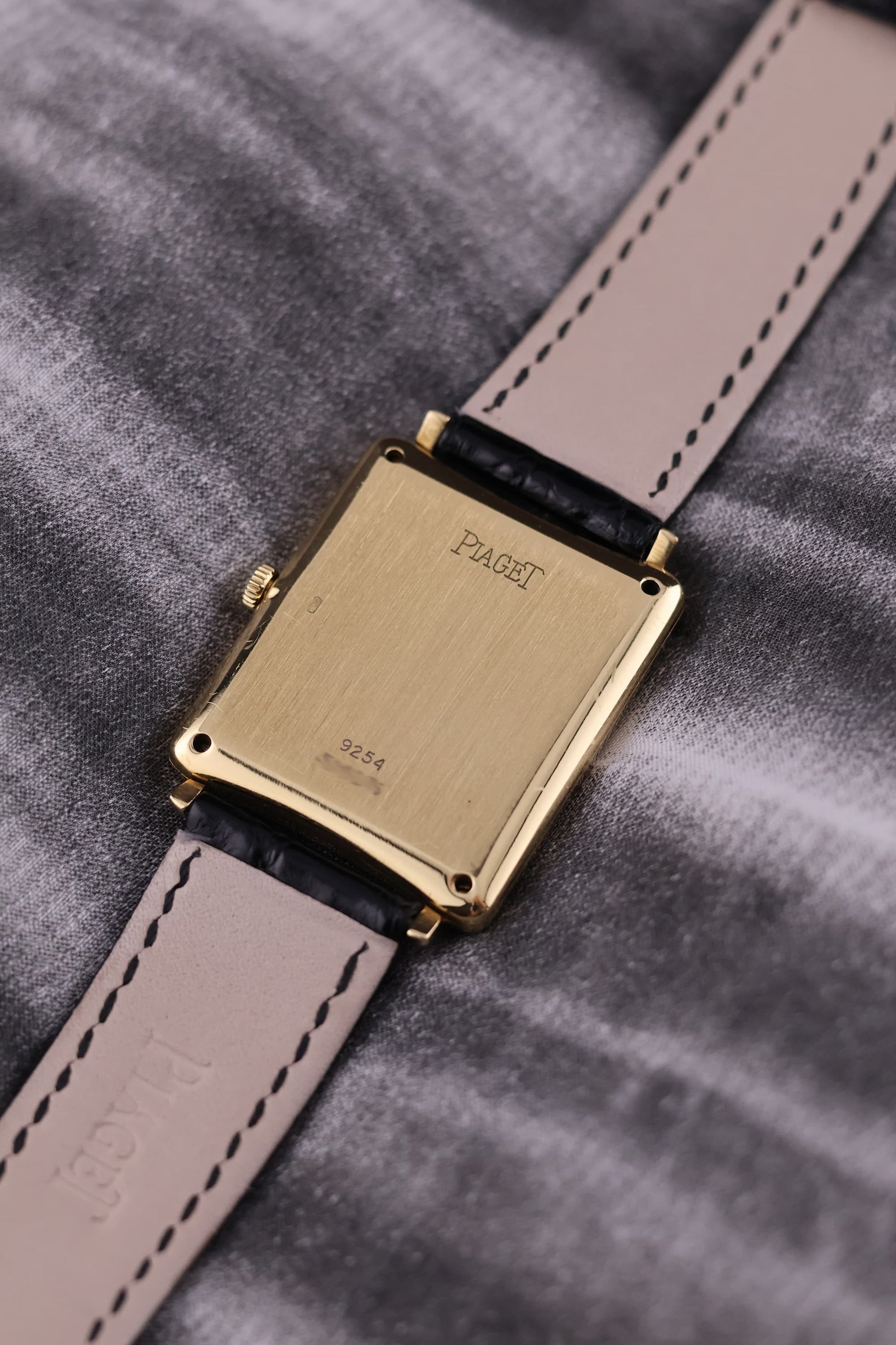 Rear view of the Piaget 9251 showing the solid 18K yellow gold case back with subtle hallmarks and signs of gentle wear.
