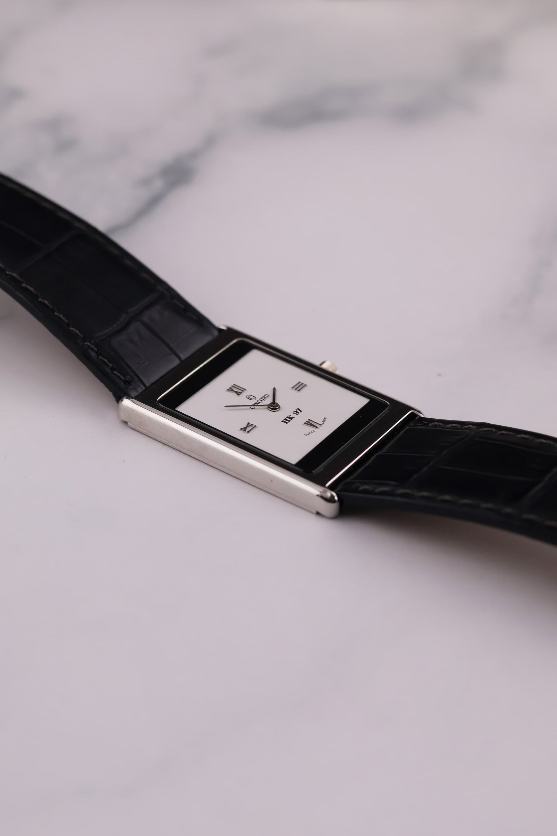 Side profile of the Concord Delirium 1997, emphasizing its remarkable 4.1mm thinness and sleek platinum construction.