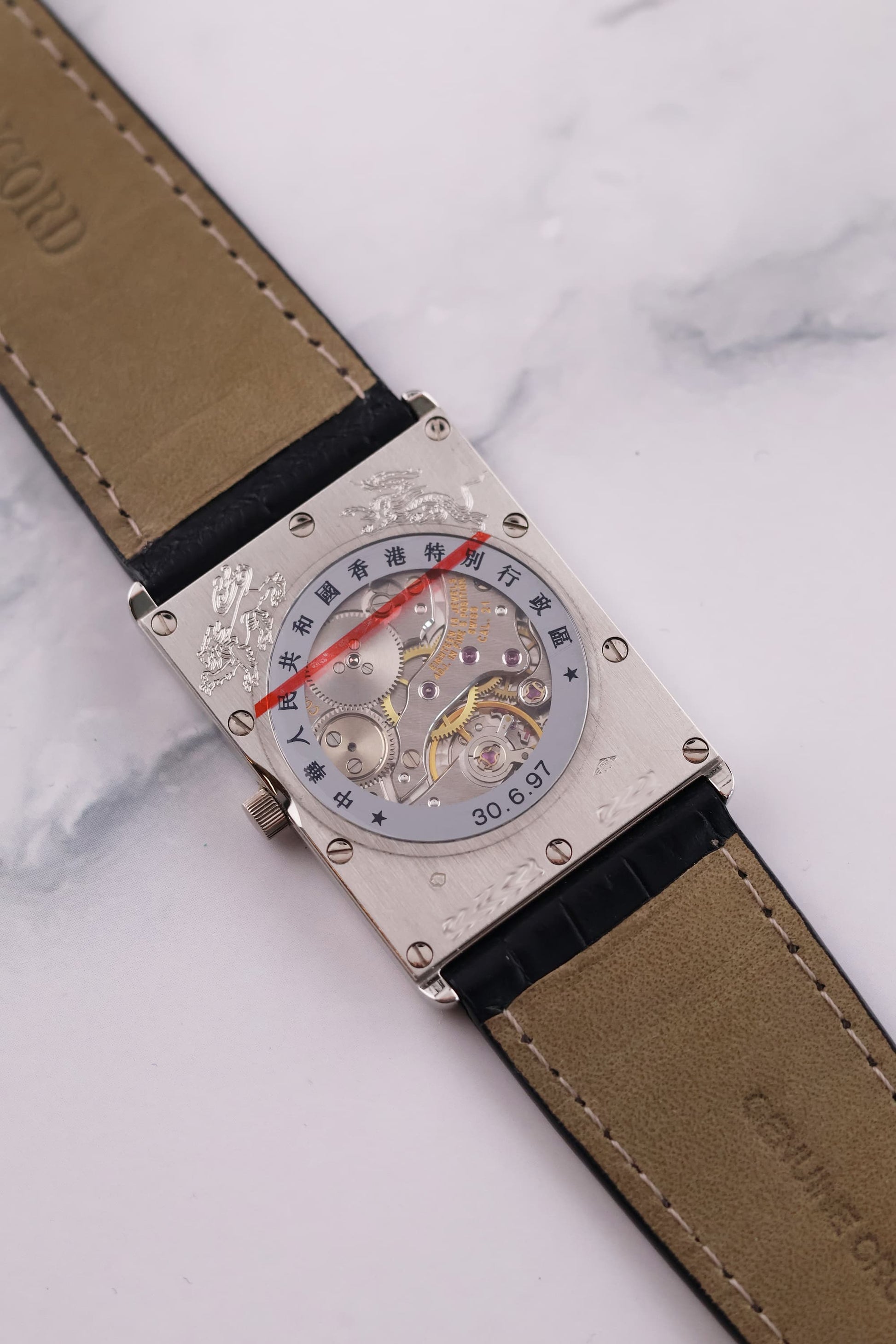 View of the sapphire exhibition caseback, revealing the rare manual winding movement inside the Concord Delirium 1997.