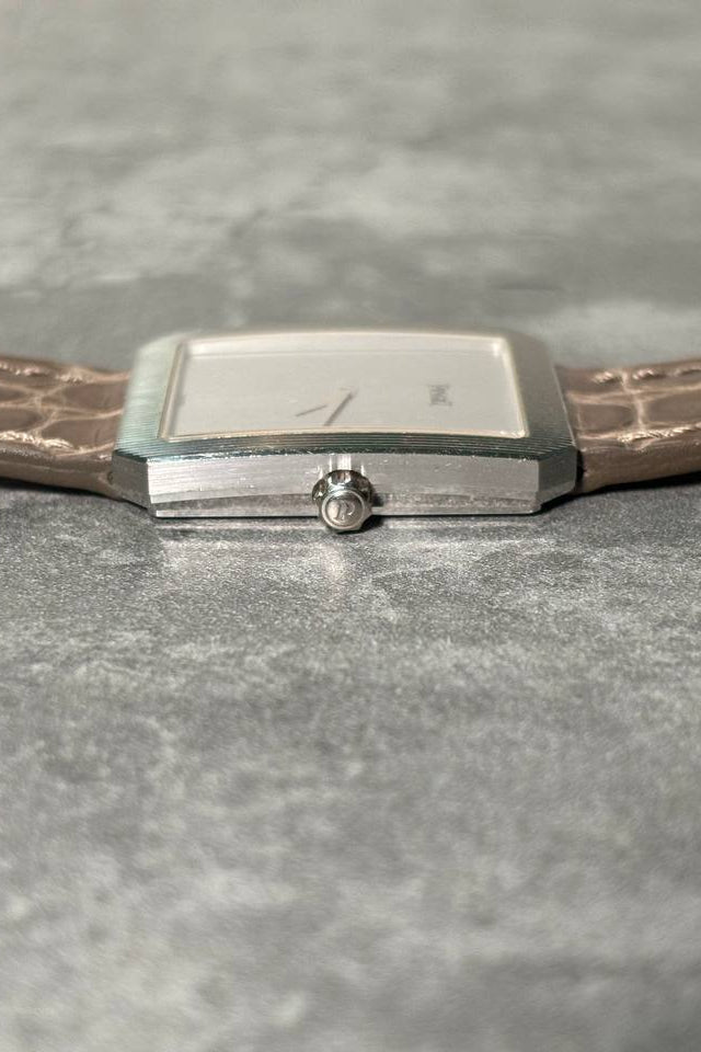 Piaget Protocole 90154 side view with crown, featuring sculpted case and engraved white gold bezel