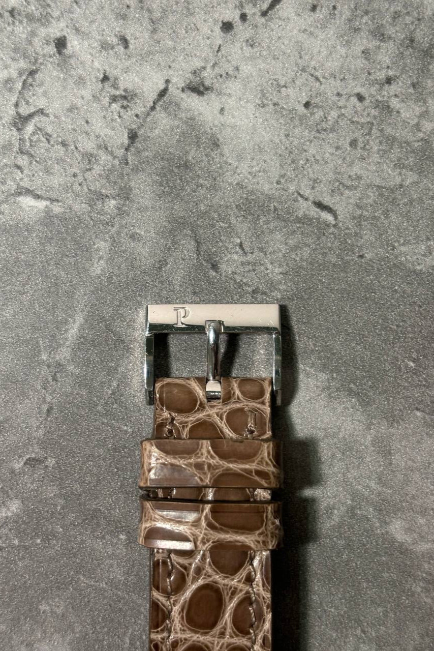 Original Piaget 18K white gold buckle on black leather strap, paired with Protocole Ref. 90154