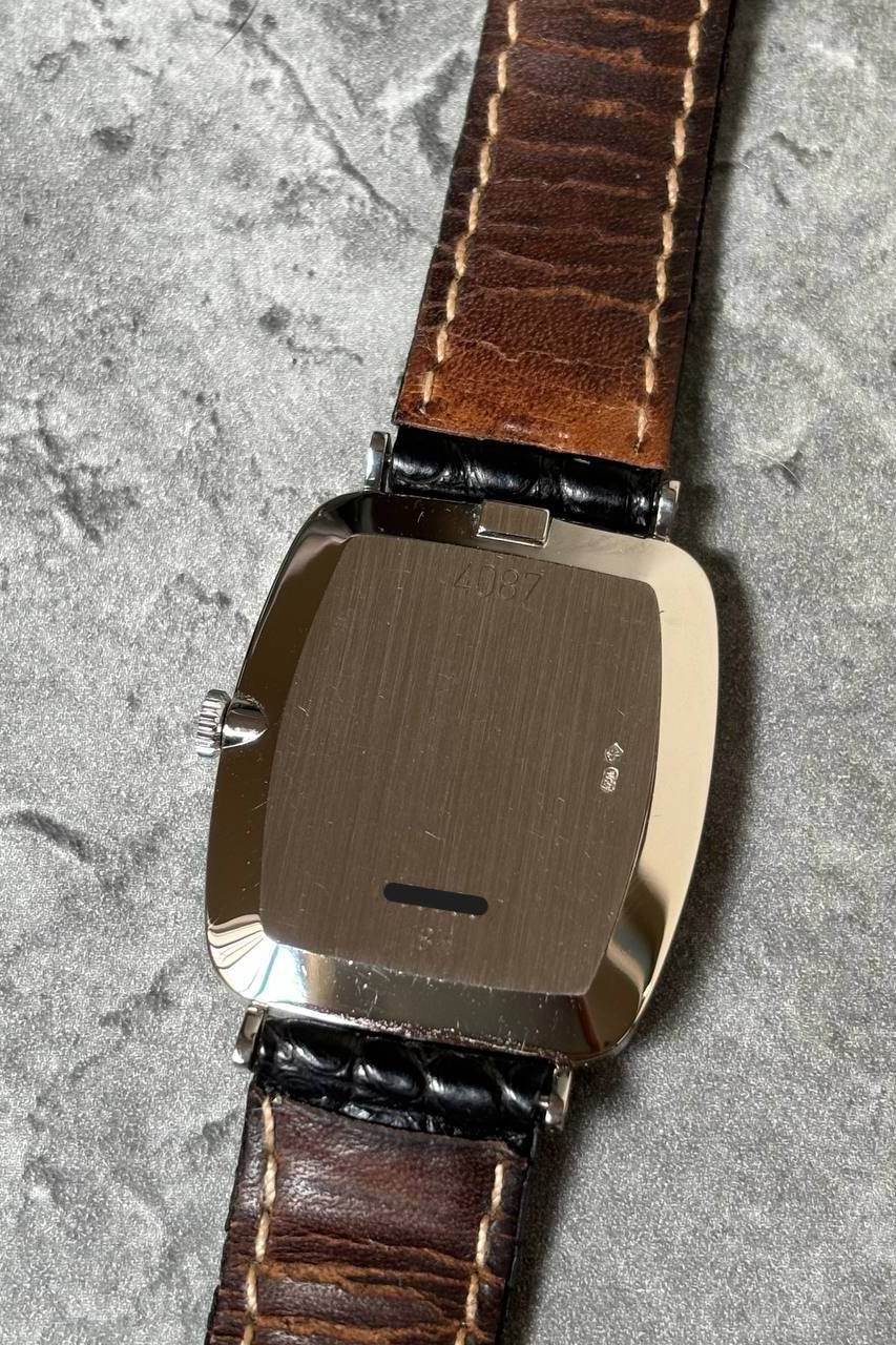 Case back of Rolex Cellini Ref. 4087 in 18K white gold, showcasing elegant cushion shape and vintage detailing