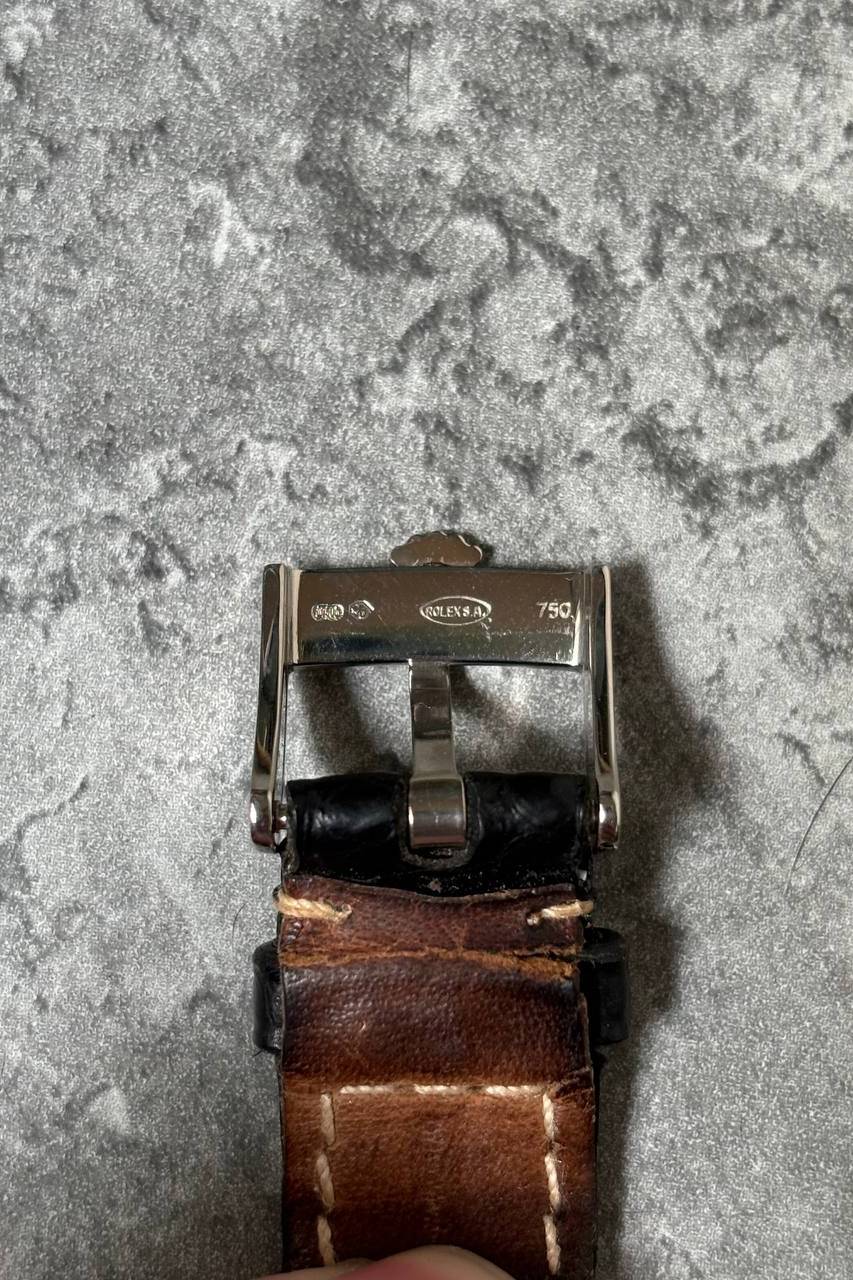 Original Rolex 18K white gold buckle attached to leather strap, signed with Rolex coronet logo