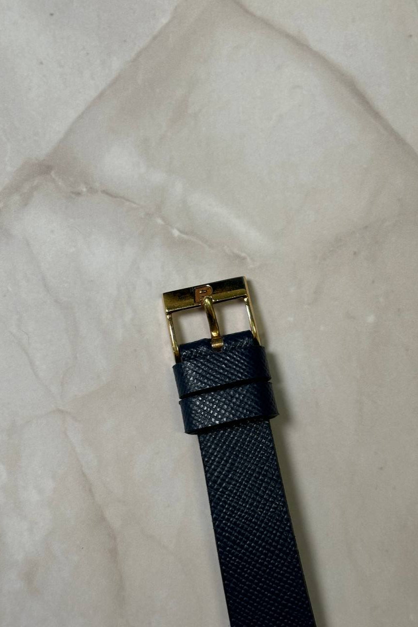 Original Piaget 18K yellow gold buckle on leather strap, signed and period-correct for Ref. 7143